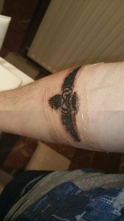 Tattoo with dried blood covered with protective foil