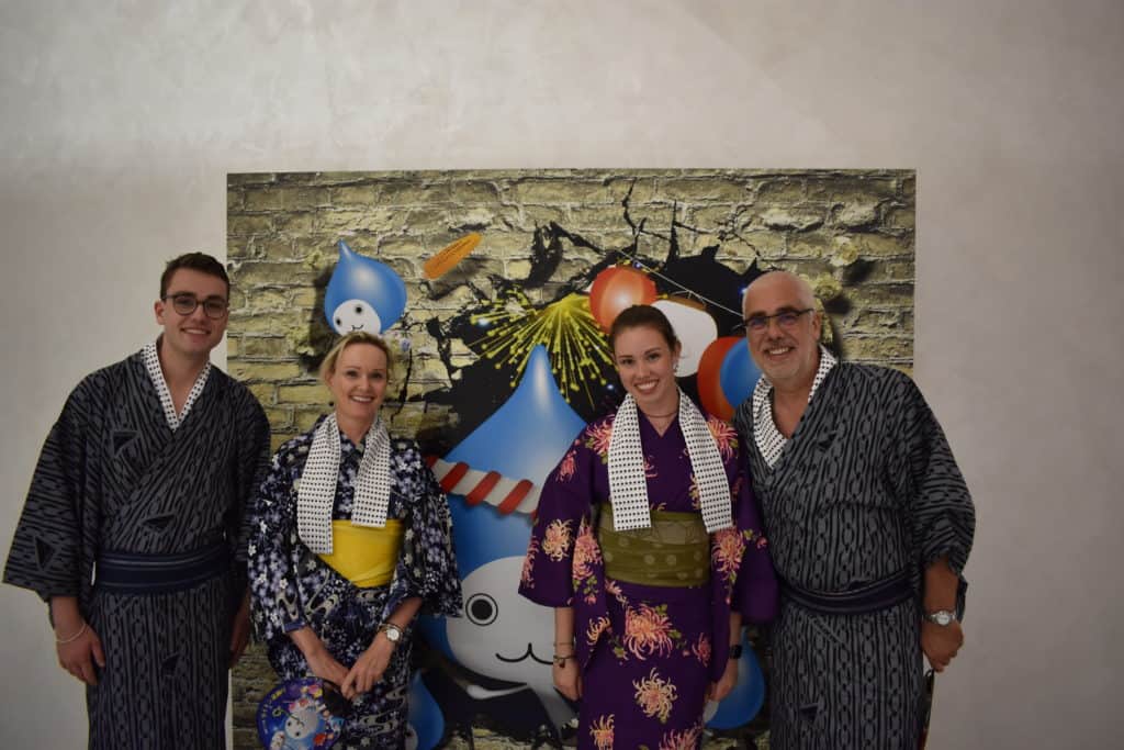 Family of four dressed in Japanese yukatas for Bon Odori Festival