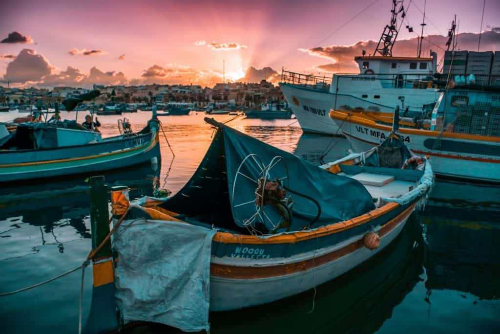 Solo travel in Malta: don't miss a visit to the village Marsaxlokk with its colourful fishing boats
