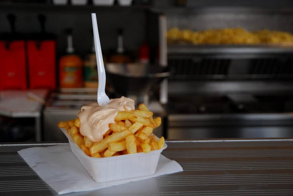 The perfect tray of Belgian fries in a so-called frituur (easy-going eatery selling fries)